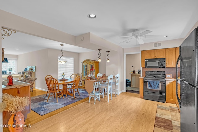 2 Apache Dr, Toms River, NJ 08753 - kitchen with black appliances, ceiling fan, light wood-type flooring, decorative light fixtures, and recessed lighting