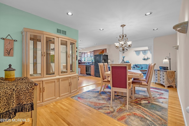 2 Apache Dr, Toms River, NJ 08753 - dining area with light wood-type flooring, recessed lighting, and a chandelier