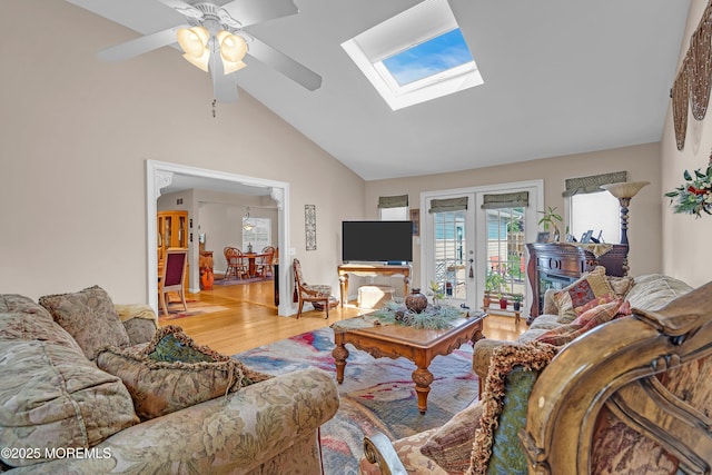 2 Apache Dr, Toms River, NJ 08753 - living area featuring wood finished floors, vaulted ceiling, a skylight, ceiling fan, and french doors