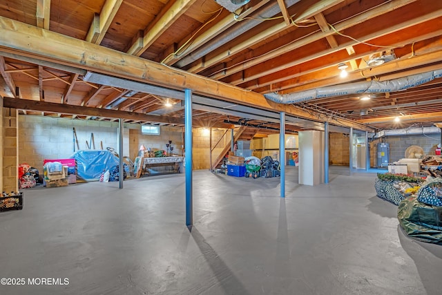 2 Apache Dr, Toms River, NJ 08753 - unfinished basement featuring electric water heater, stairs, and concrete block wall