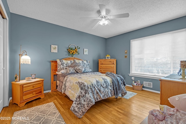 2 Apache Dr, Toms River, NJ 08753 - bedroom featuring a textured ceiling, wood finished floors, and a ceiling fan