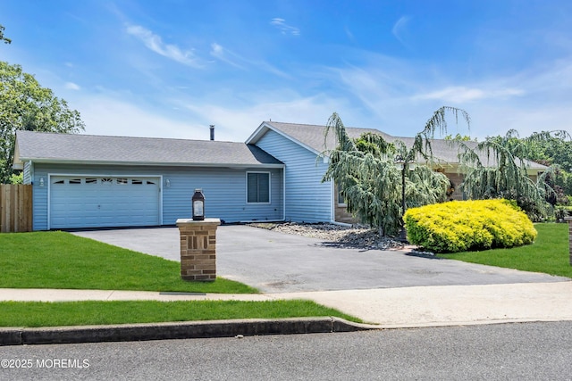 2 Apache Dr, Toms River, NJ 08753 - view of front of house with asphalt driveway and an attached garage