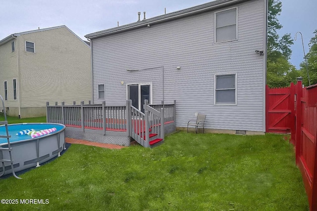 207 Delaware Ave, Cliffwood, NJ 07721 - rear view of house with a wooden deck and an outdoor pool