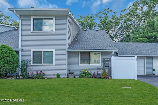26 Kathy Ct, Brick, NJ 08724 - view of front of house featuring roof with shingles and a front lawn