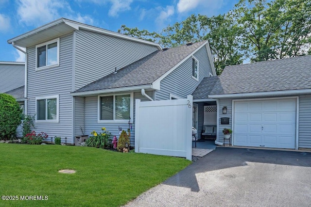 26 Kathy Ct, Brick, NJ 08724 - view of front of home featuring an attached garage, roof with shingles, and asphalt driveway