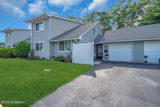 26 Kathy Ct, Brick, NJ 08724 - view of front of property with an attached garage, asphalt driveway, and roof with shingles