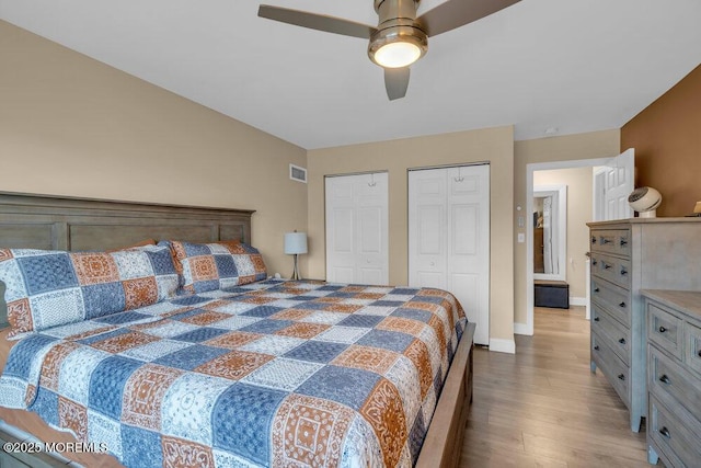 26 Kathy Ct, Brick, NJ 08724 - bedroom featuring multiple closets, wood finished floors, and a ceiling fan