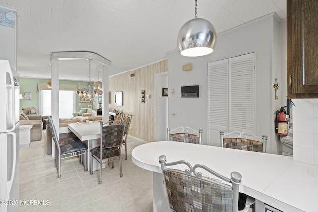 51 Hiering Ave Unit C 12, Seaside Heights, NJ 08751 - dining room with a chandelier and light tile patterned floors