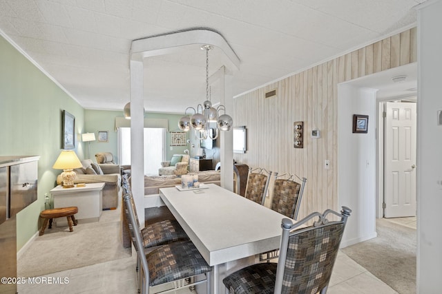 51 Hiering Ave Unit C 12, Seaside Heights, NJ 08751 - dining space with ornamental molding, light colored carpet, a chandelier, and light tile patterned floors