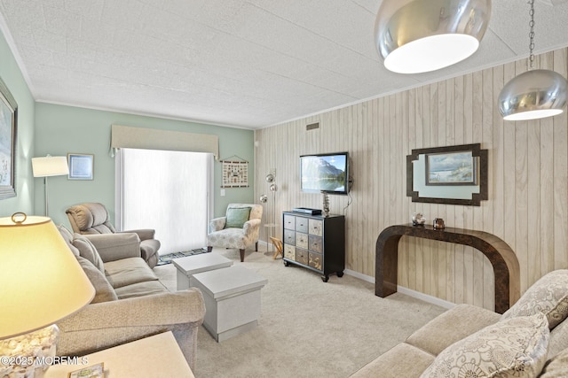 51 Hiering Ave Unit C 12, Seaside Heights, NJ 08751 - carpeted living area featuring plenty of natural light, ornamental molding, and wooden walls