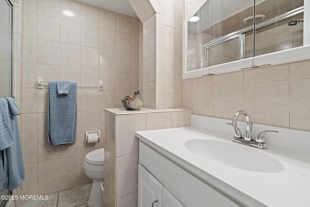 51 Hiering Ave Unit C 12, Seaside Heights, NJ 08751 - bathroom featuring tile walls, vanity, a tile shower, and tile patterned floors