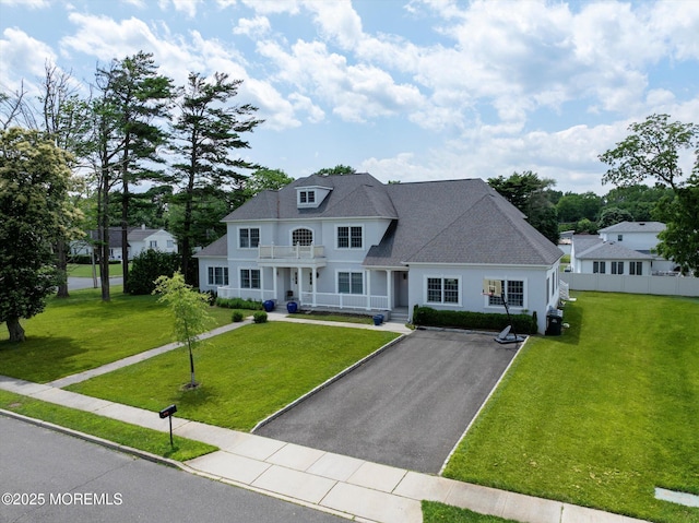 1 Country Club Dr, Deal, NJ 07723 - view of front of house featuring a balcony, a porch, driveway, and a front yard