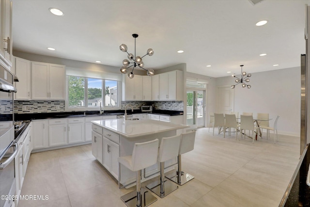 1 Country Club Dr, Deal, NJ 07723 - kitchen featuring a chandelier, healthy amount of natural light, decorative backsplash, and recessed lighting