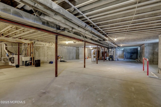 1 Country Club Dr, Deal, NJ 07723 - unfinished below grade area featuring separate washer and dryer and a sink
