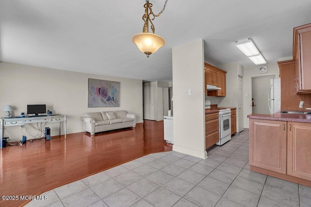 101 S Plaza Pl Unit 806, Atlantic City, NJ 08401 - kitchen featuring white appliances, open floor plan, under cabinet range hood, and an office area