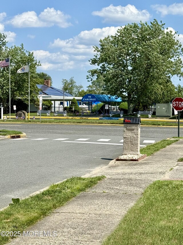 3 Tivoli St, Toms River, NJ 08757 - view of asphalt road featuring sidewalks, traffic signs, and curbs