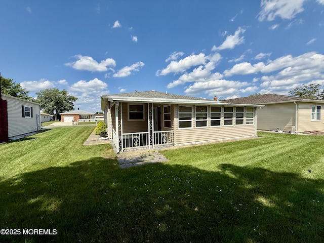 3 Tivoli St, Toms River, NJ 08757 - back of property with a yard and a sunroom