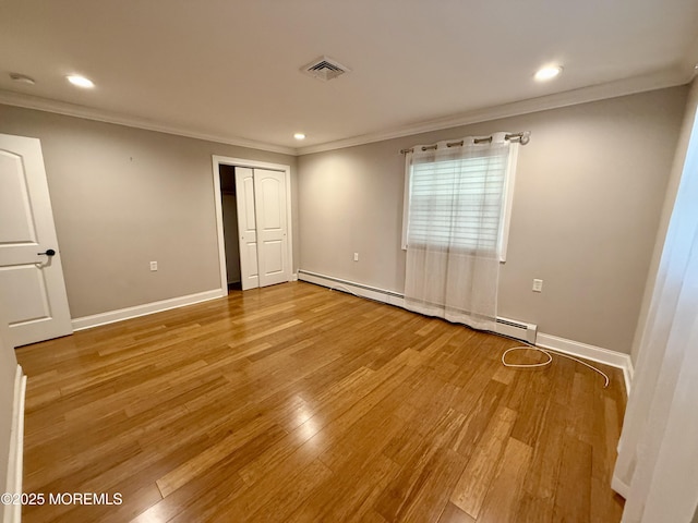3 Tivoli St, Toms River, NJ 08757 - unfurnished bedroom featuring baseboard heating, ornamental molding, light wood finished floors, recessed lighting, and a closet