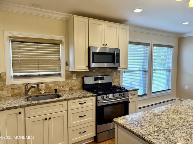 3 Tivoli St, Toms River, NJ 08757 - kitchen featuring appliances with stainless steel finishes, baseboard heating, white cabinets, crown molding, and backsplash