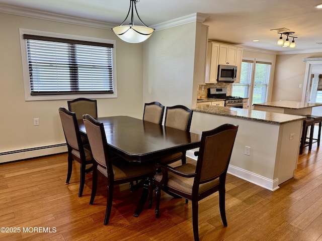 3 Tivoli St, Toms River, NJ 08757 - dining space with crown molding, light wood-type flooring, and baseboard heating