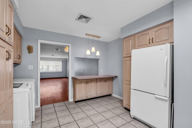 16A Mallard St, Manchester, NJ 08759 - kitchen featuring freestanding refrigerator, washing machine and clothes dryer, light brown cabinets, decorative light fixtures, and light countertops