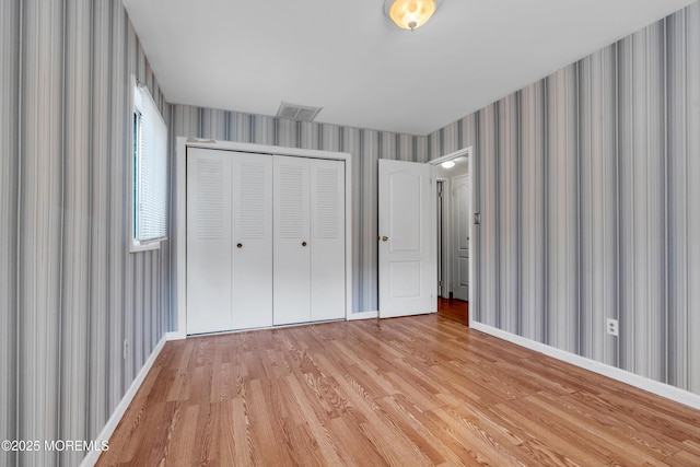 16A Mallard St, Manchester, NJ 08759 - unfurnished bedroom with wallpapered walls, light wood-type flooring, and a closet