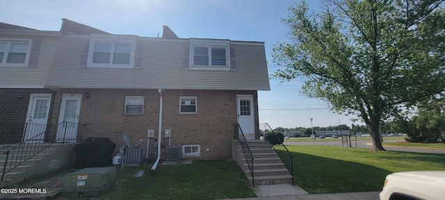 23 Primrose Ln, Brick, NJ 08724 - view of property exterior with a yard and brick siding