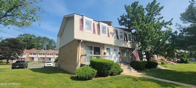 23 Primrose Ln, Brick, NJ 08724 - townhome / multi-family property featuring brick siding and a front lawn