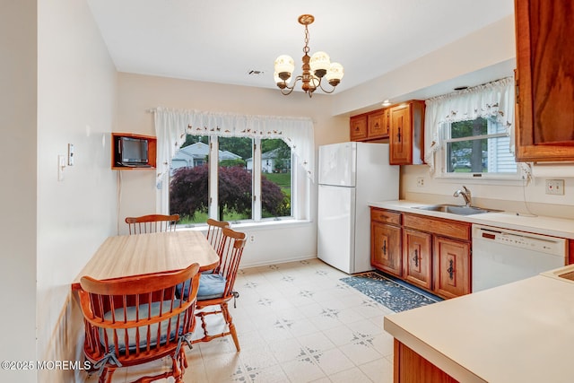 231 Valley Forge Dr, Little Egg Harbor, NJ 08087 - kitchen with white appliances, healthy amount of natural light, and brown cabinetry