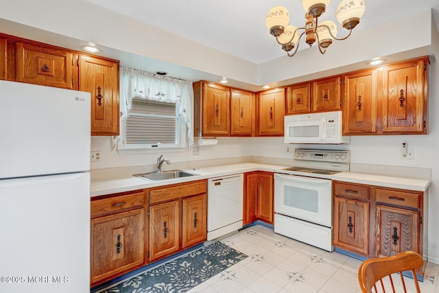 231 Valley Forge Dr, Little Egg Harbor, NJ 08087 - kitchen featuring white appliances, a chandelier, brown cabinetry, and recessed lighting