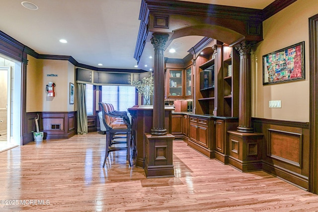 2 Red Oak, Holmdel, NJ 07733 - bar with decorative columns, crown molding, a decorative wall, a wainscoted wall, and arched walkways