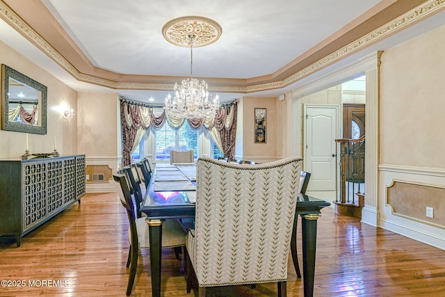 2 Red Oak, Holmdel, NJ 07733 - dining space with a chandelier, a tray ceiling, wood finished floors, wainscoting, and a decorative wall