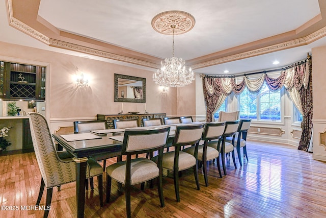 2 Red Oak, Holmdel, NJ 07733 - dining room featuring a decorative wall, a chandelier, a wainscoted wall, wood finished floors, and a tray ceiling