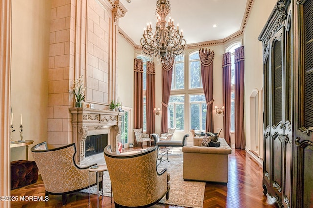 2 Red Oak, Holmdel, NJ 07733 - sitting room featuring a towering ceiling, a chandelier, a fireplace, and ornamental molding