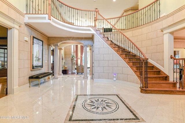 2 Red Oak, Holmdel, NJ 07733 - entrance foyer with decorative columns, a towering ceiling, marble tiled floors, stairs, and arched walkways