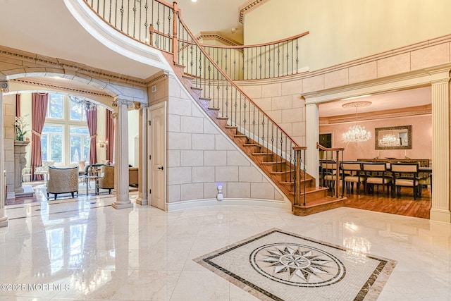 2 Red Oak, Holmdel, NJ 07733 - stairs with ornate columns, a high ceiling, marble tiled flooring, a chandelier, and ornamental molding