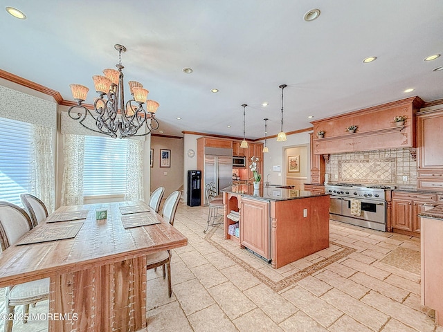 2 Red Oak, Holmdel, NJ 07733 - kitchen with high end appliances, ornamental molding, a kitchen breakfast bar, a chandelier, and backsplash