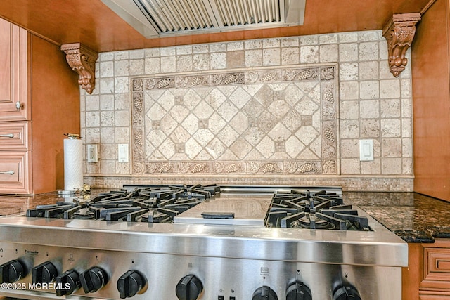 2 Red Oak, Holmdel, NJ 07733 - kitchen with range, decorative backsplash, dark stone counters, and brown cabinetry