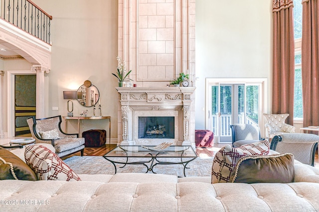 2 Red Oak, Holmdel, NJ 07733 - living room with a high ceiling, arched walkways, wood finished floors, and a fireplace