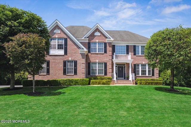 24 Rutledge Rd, Marlboro, NJ 07746 - colonial-style house with brick siding and a front lawn