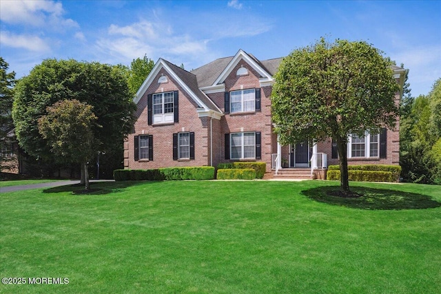 24 Rutledge Rd, Marlboro, NJ 07746 - view of front of property with brick siding and a front yard