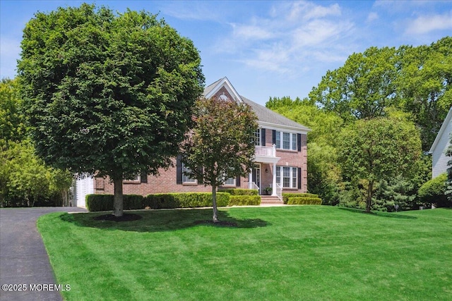 24 Rutledge Rd, Marlboro, NJ 07746 - view of front of property featuring a front yard and brick siding