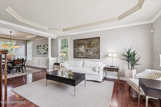 24 Rutledge Rd, Marlboro, NJ 07746 - living room featuring a tray ceiling, ornate columns, dark wood-type flooring, and crown molding