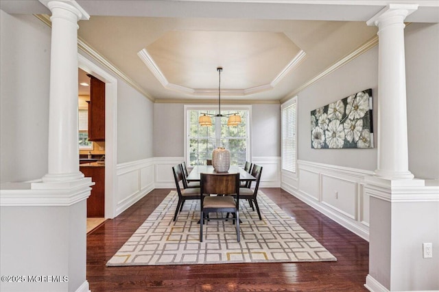 24 Rutledge Rd, Marlboro, NJ 07746 - dining room featuring dark wood finished floors, wainscoting, a raised ceiling, crown molding, and a decorative wall