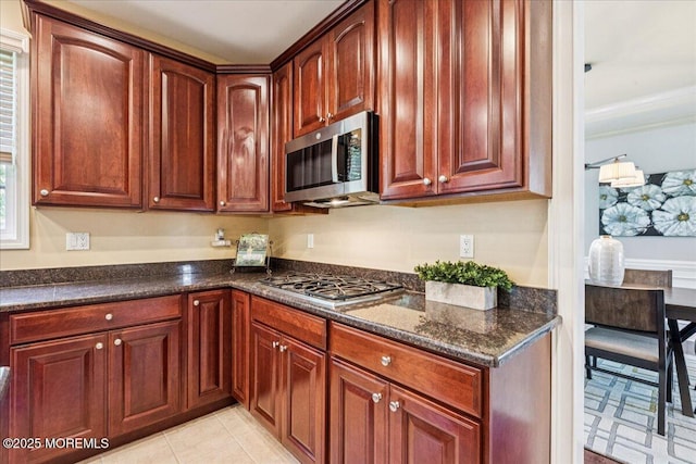 24 Rutledge Rd, Marlboro, NJ 07746 - kitchen featuring appliances with stainless steel finishes, dark stone counters, and ornamental molding