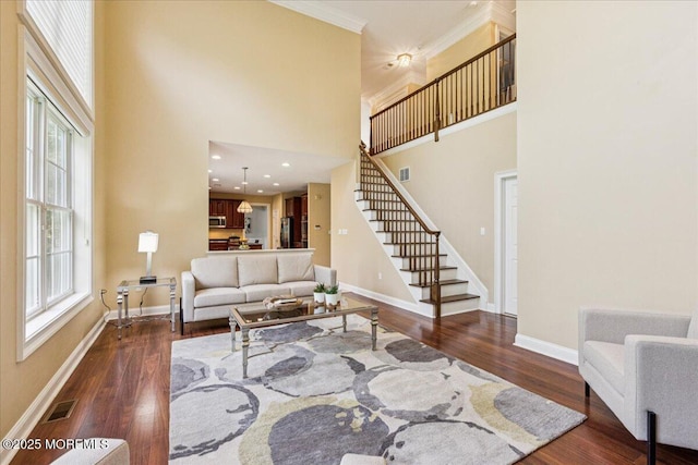 24 Rutledge Rd, Marlboro, NJ 07746 - living room featuring stairway, a high ceiling, wood finished floors, and ornamental molding