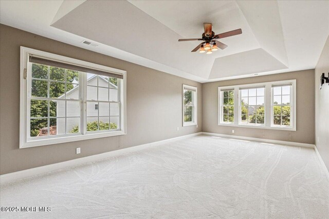 24 Rutledge Rd, Marlboro, NJ 07746 - carpeted empty room with a tray ceiling and a ceiling fan