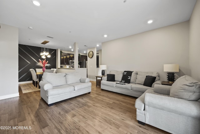518 Tavern Rd, Monroe, NJ 08831 - living room with a chandelier, wood finished floors, and recessed lighting