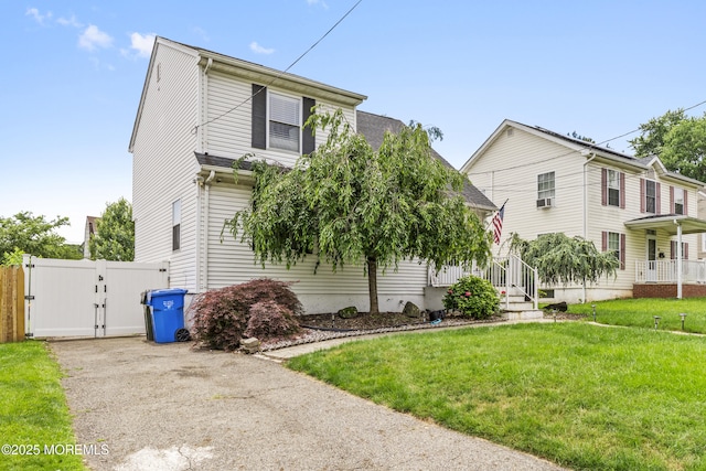 81 Lockwood Ave, Woodbridge, NJ 07095 - view of front of property with a gate, a front yard, and asphalt driveway