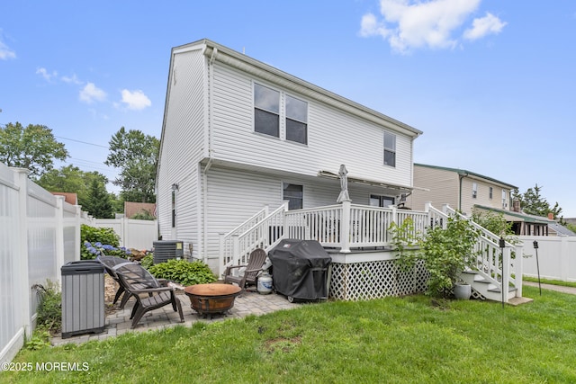 81 Lockwood Ave, Woodbridge, NJ 07095 - rear view of house featuring a fire pit, a wooden deck, a fenced backyard, a patio, and stairway
